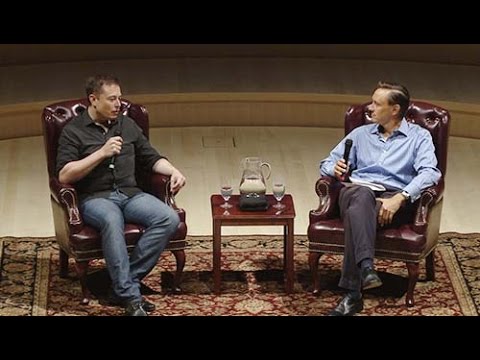 Elon Musk and Steve Jurvetson seated onstage at Stanford. Official still from Stanford eCorner.